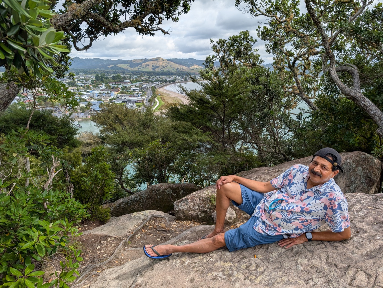 Dad on a rock above the bay